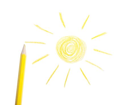 Yellow pencil and the drawn sun on a white backgroundの写真素材
