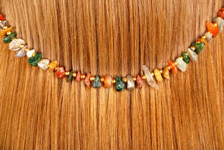 Background from red hair with jewelryの写真素材