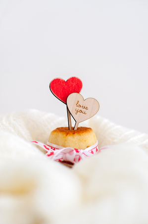 Topper in the shape of a heart stuck in cupcakesの写真素材