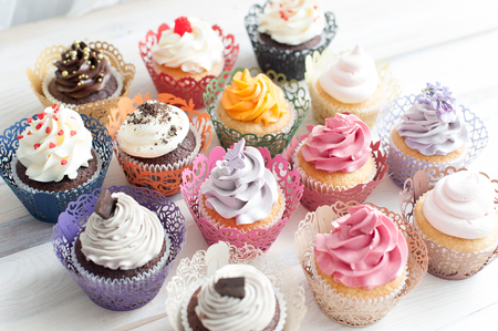 Many different colored delicious cupcakesの写真素材
