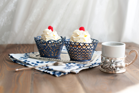 Birthday cupcake wrapped with a pattern is on the tableの写真素材