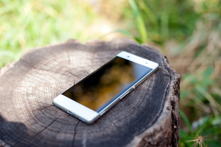 White smartphone with a protective film on the stumpの写真素材