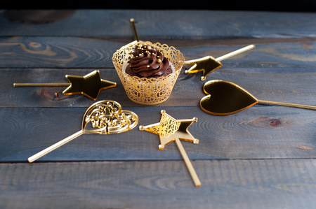 Chocolate cupcakes with gold acrylic toppersの写真素材
