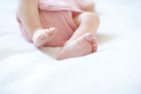 Feet of newborn baby with copyspaceの写真素材