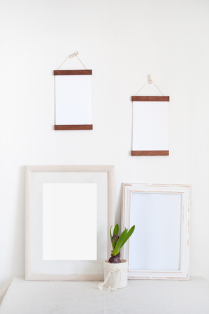 Four wooden frames in the white interiorの写真素材