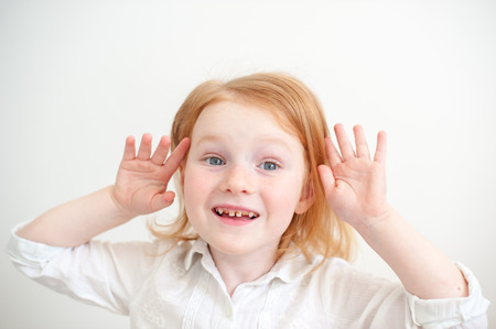 Red-haired girl with dental caries