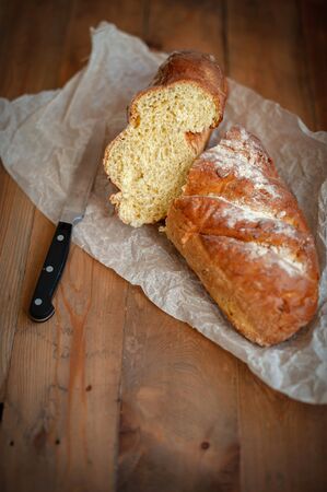 Freshly baked appetizing bread on the boardの写真素材