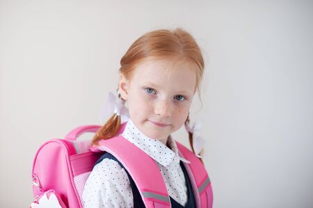 Red-haired schoolgirl indoorsの写真素材