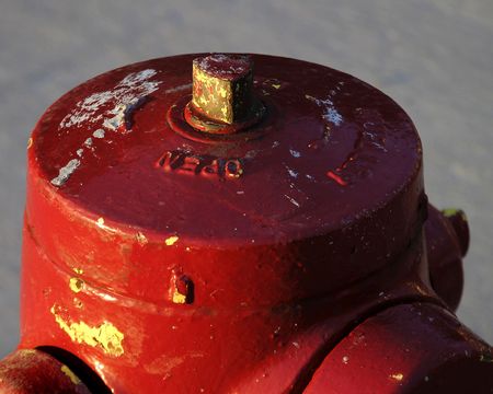 The top of a red fire hydrant in saskatoon, saskatchewan, Canada