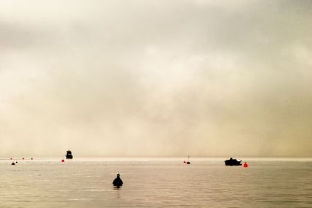 Buoy on a foggy oceanの写真素材