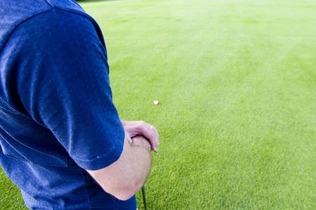 Abstract of golfer on a golf courseの写真素材