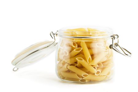 Penne Rigate pasta in a glass jarの写真素材