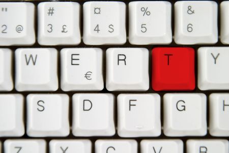 Isolated letter T on from a computer desktop keyboard highlighted in redの写真素材
