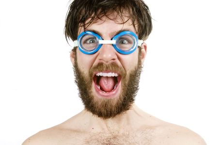A humorous image of a young bearded male wearing swimming goggles, yelling.の写真素材