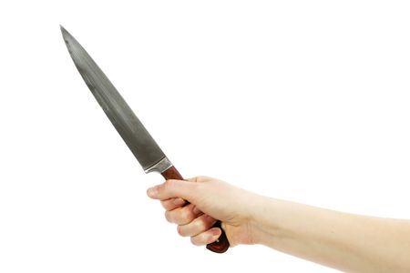 A hand holding a large butcher knife isolated on white with .