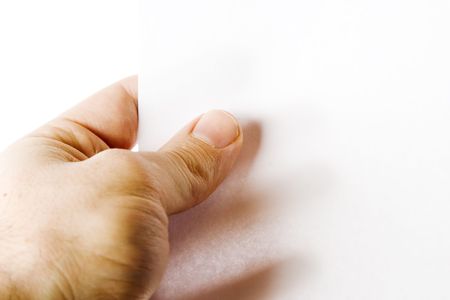 A males hand holding up a white paper with nothing on it (put on your own text or image or leave as blank).  Isolated on whiteの写真素材