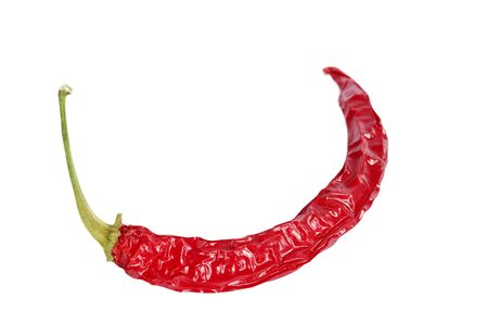 A dry red hot chilli pepper isolated on white with .の写真素材