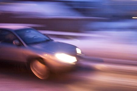 A abstract blur image of a car travelling at night.の写真素材