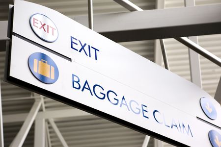 Baggage claim and exit sign in an airportの写真素材