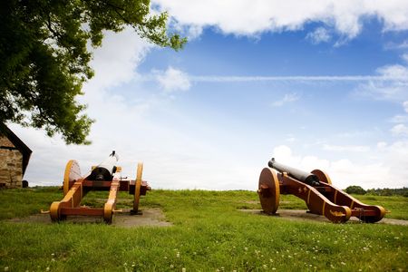 Two old canons on a old fortress wallの写真素材