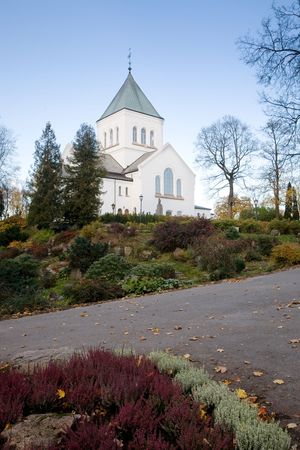A church on top of a green hillの写真素材