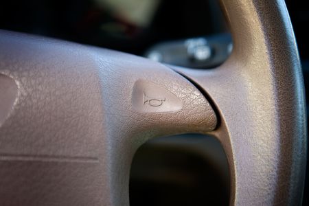 A car horn on a steering wheelの写真素材