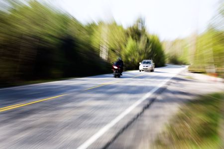 A motion blur image of a speeding carの写真素材