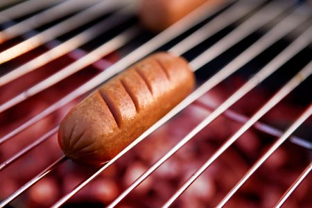 A hotdog on a grill の写真素材