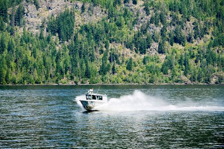 A rescue maintenance boat on a lakeの写真素材