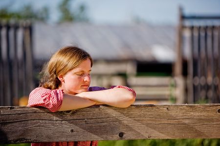 A country farm girl taking a breakの写真素材