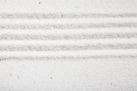 A pattern in white sand, background imageの写真素材