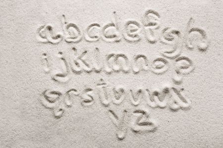 lower case alphabet written in sand - a designers toolの写真素材