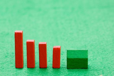 Housing market concept image with graph and toy houseの写真素材