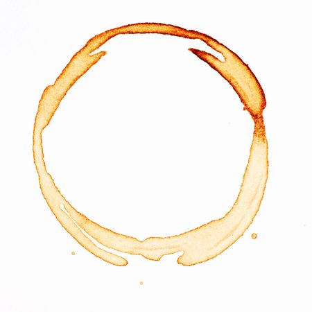 A coffee stain on a desk or paper isolated on whiteの写真素材