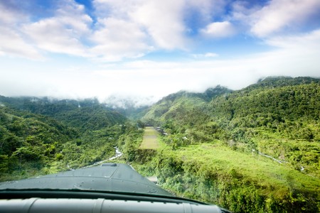 A runway in a mountain village - approachnig with a small aircraft