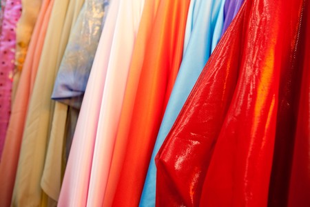 A bulk collection of silk cloth hanging on rollsの写真素材