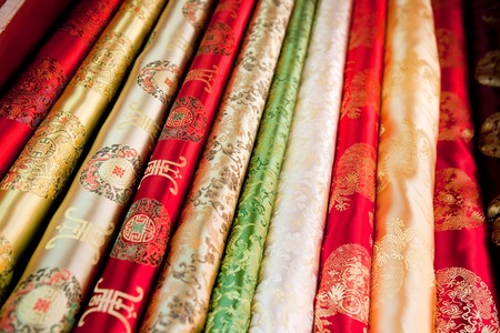 A collection of asian cloth on the roll background patternの写真素材