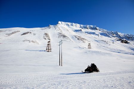 A winter landscape with a snowmobileの写真素材