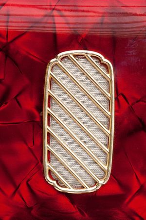 A detail image of an old retro slightly dusty accordion speakerの写真素材