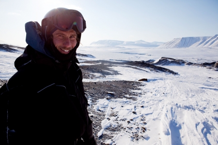 A winter adventure guide on a barren winter landscapeの写真素材