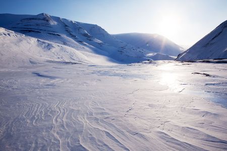 A beautiful winter moutain snow landscape taken on Spitsbergen Island, Svalbard, Norwayの写真素材