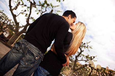 A couple kissing in a urban city park in Franceの写真素材