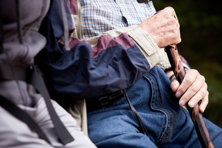 Detail of an elderly man with walking stickの写真素材
