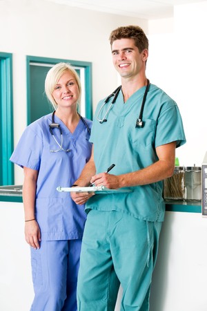 A portrait of a veterinarian and  assistant in a small animal clinicの写真素材