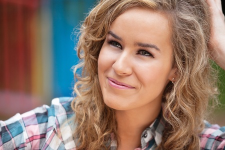 Beautiful young woman looking away and smilingの写真素材