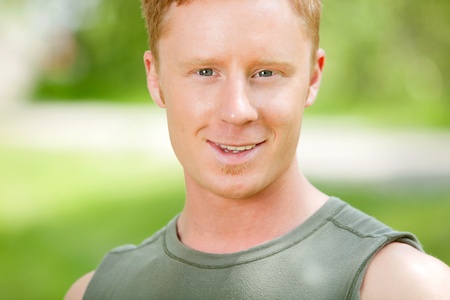 Portrait of a Caucasian man smiling against blur backgroundの写真素材