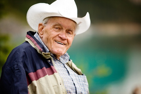 A portrait of a happy elderly man with cowboy hatの写真素材