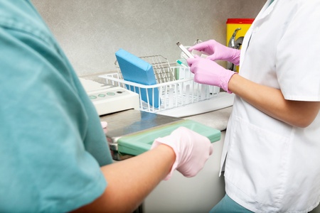 A medical professional steralizing equipmentの写真素材