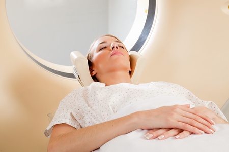 A young female taking a CT scan - medical testingの写真素材