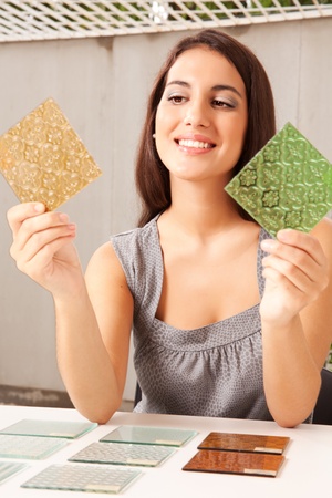 An interior architect / designer choosing a glass tile